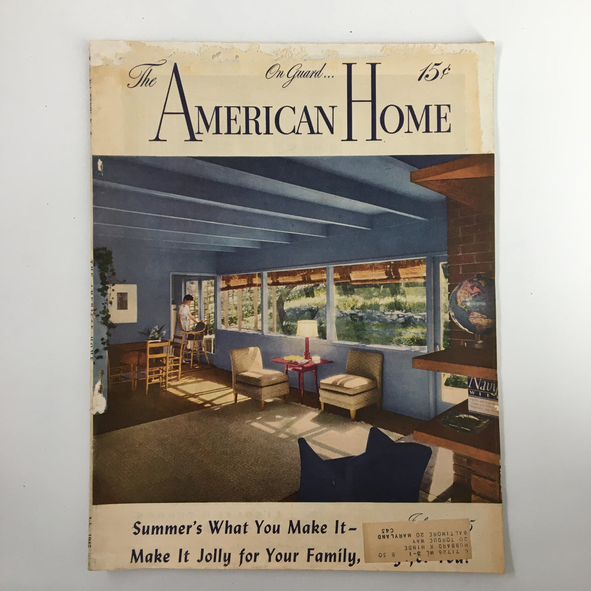 Cover of VTG The American Home Magazine July 1945, showcasing a vintage interior design with comfortable furniture and large windows, emphasizing summer themes for family comfort.