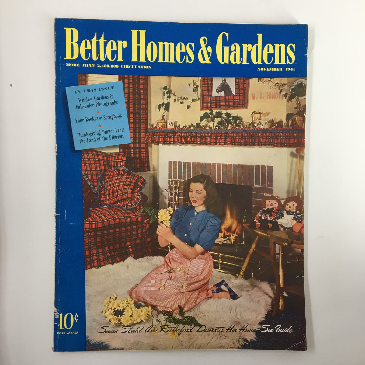 VTG Better Homes & Gardens Magazine November 1941 cover featuring a woman arranging flowers by a fireplace with festive decor, highlighting Thanksgiving and home trends.