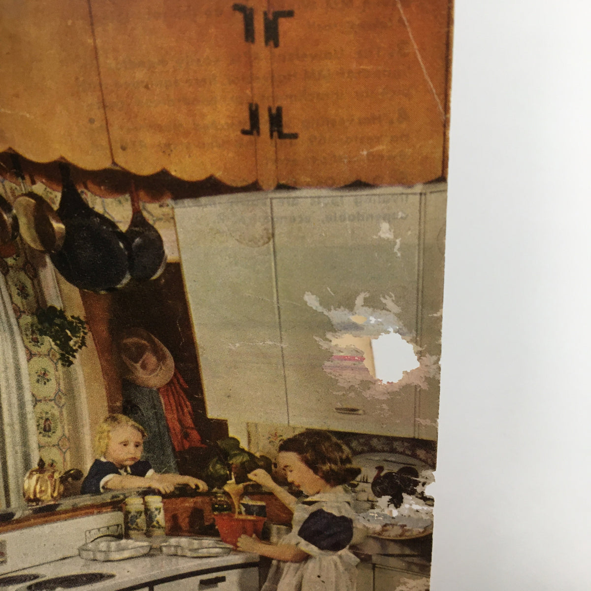 Close-up view of the top corner of the VTG Successful Farming Magazine November 1951, highlighting minor damages and revealing children engaged in cooking.