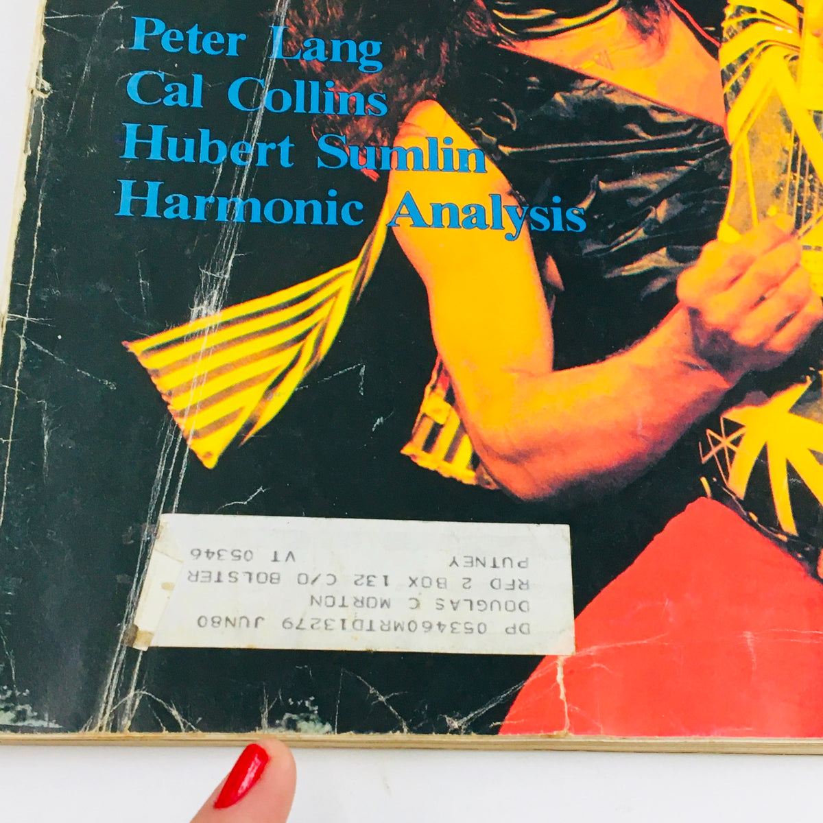 Detailed view of Guitar Player Magazine April 1980 cover with Eddie Van Halen, emphasizing names of featured musicians including Peter Lang and Cal Collins.