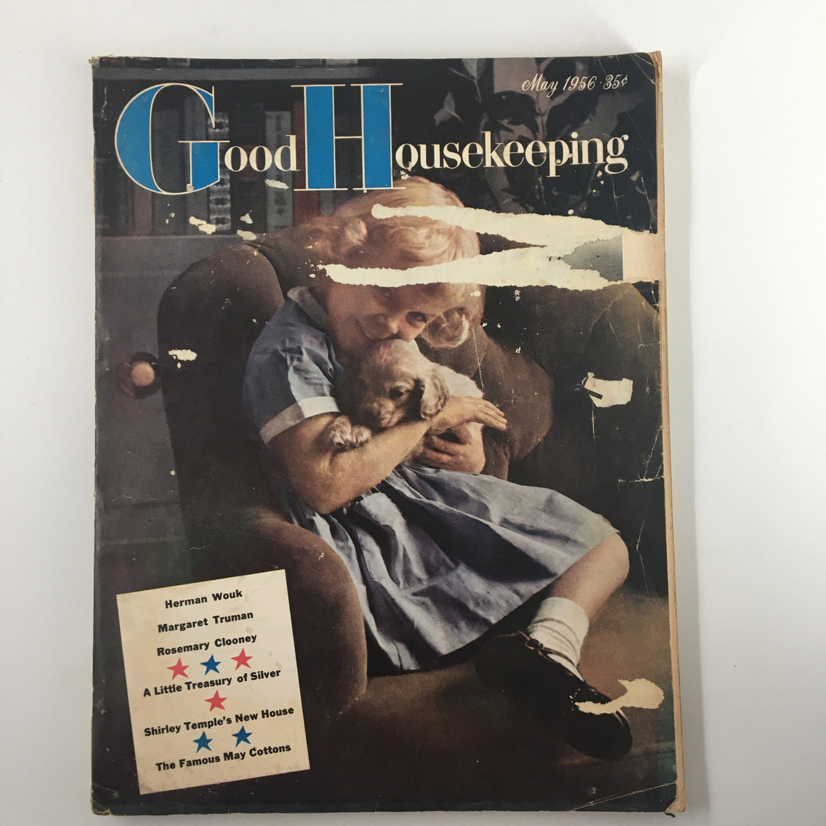 Vintage May 1956 Good Housekeeping magazine cover featuring a young girl with a puppy, titled 'A Little Treasury of Silver'. The cover showcases nostalgic mid-century design.