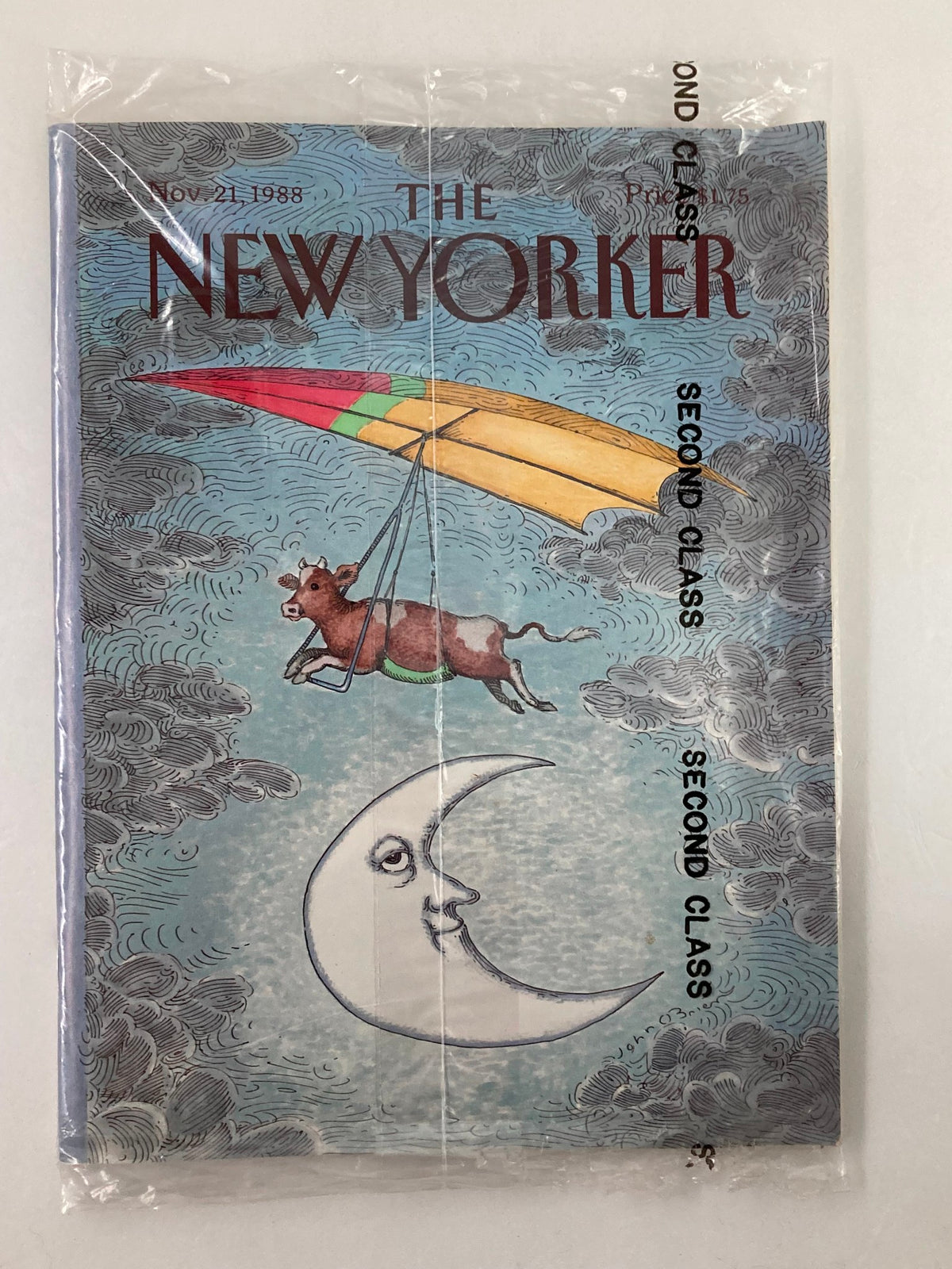 The New Yorker Full Magazine November 21 1988 featuring a whimsical cover illustration of a cow holding onto a colorful kite against a cloudy sky and a smiling moon, packaged in original plastic and in very good condition.