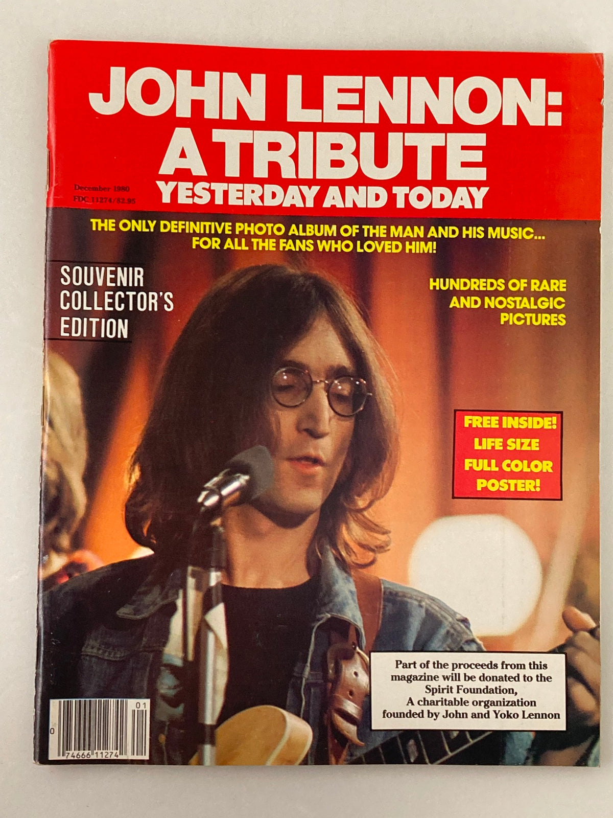 Cover of the vintage magazine 'VTG December 1980 John Lennon: A Tribute Yesterday and Today No Label' featuring John Lennon, showcasing a souvenir collector's edition with a bright red background and promotional text about rare images and a free poster.