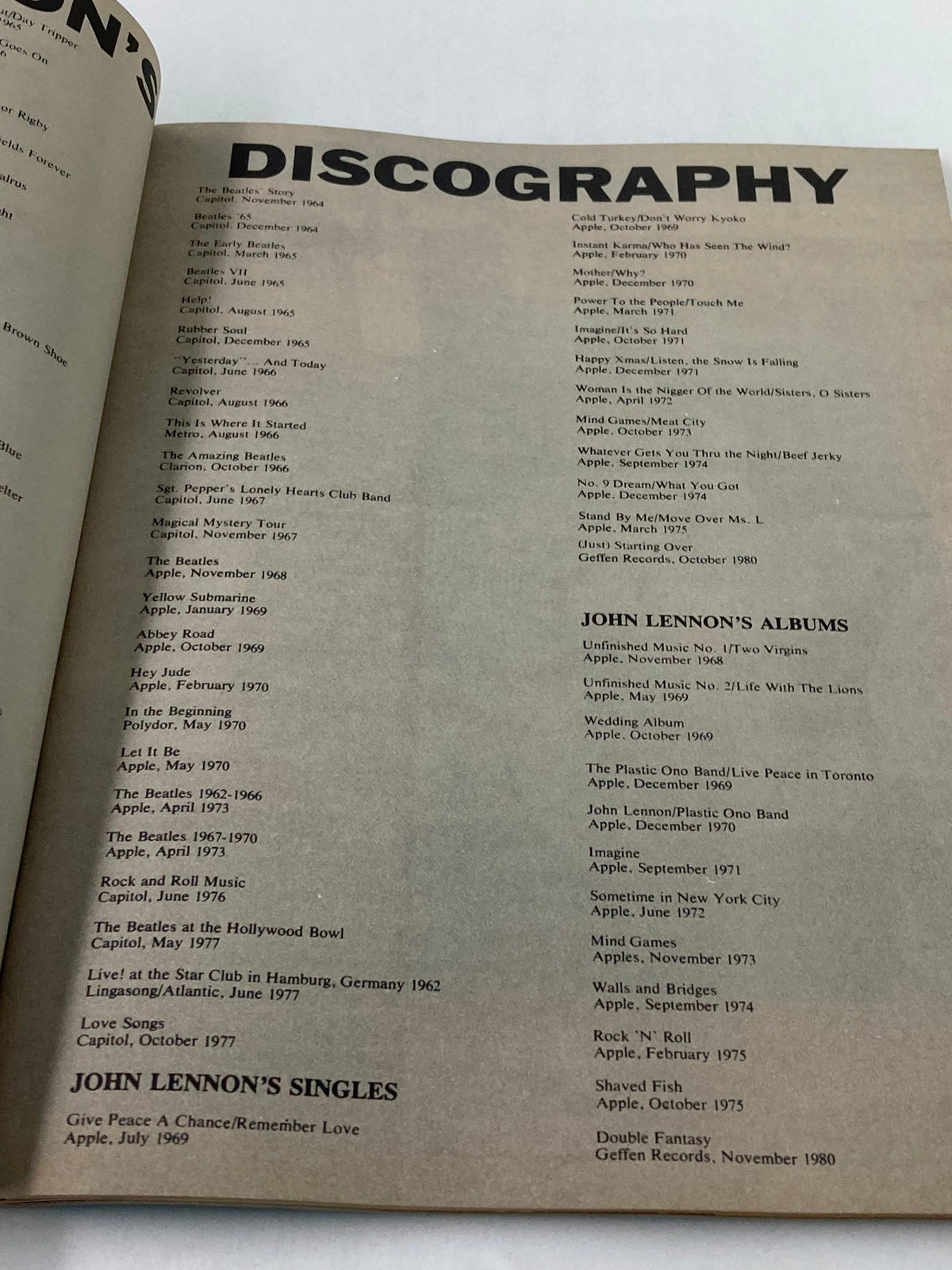 Discography page of the 1981 The Beatles' John Lennon 1940-1980 A Memorial Album showcasing John Lennon's albums and singles.