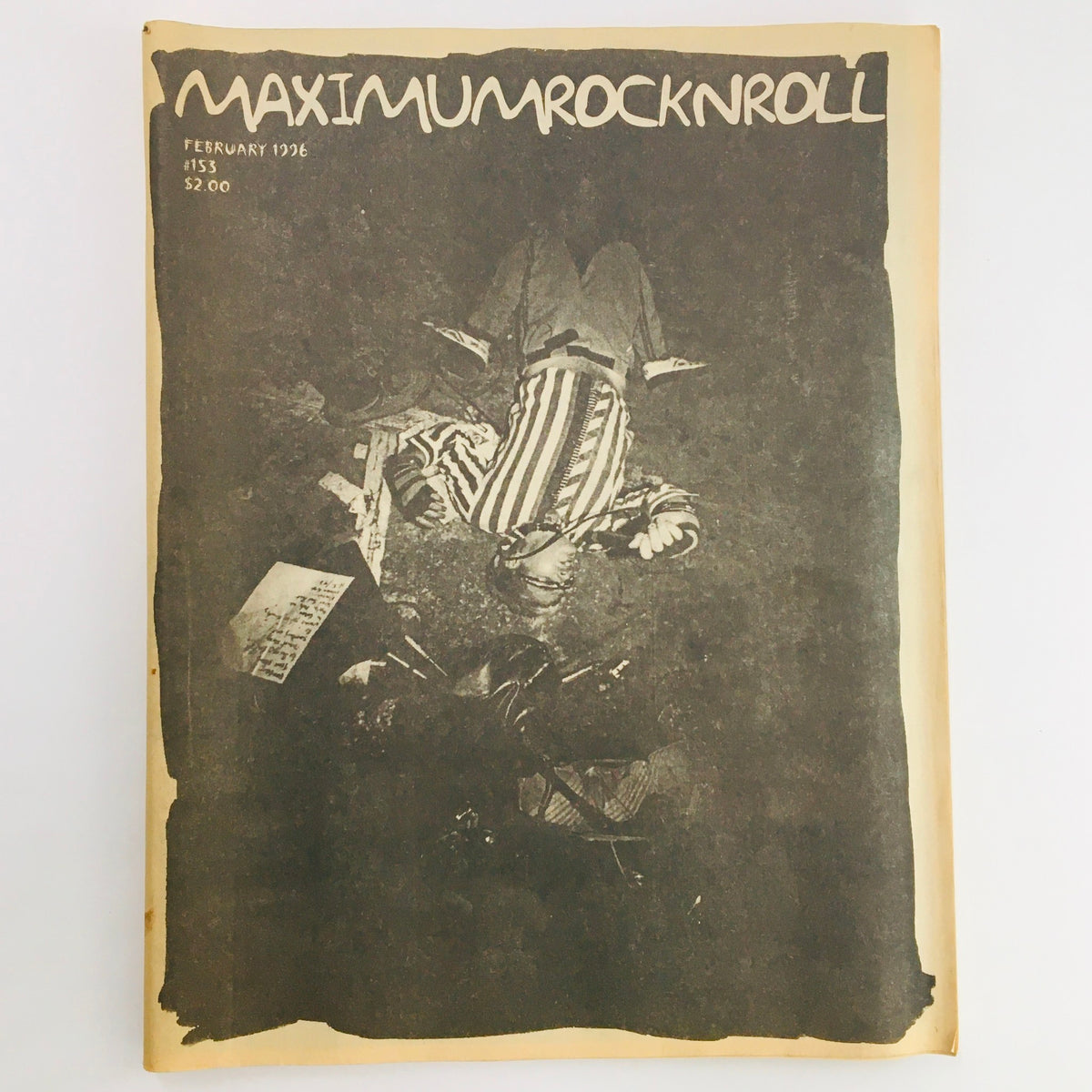 Front cover of Maximum RocknRoll Magazine February 1996 #153 featuring a striking black and white photo, showcasing punk rock culture, with the magazine title prominently displayed.