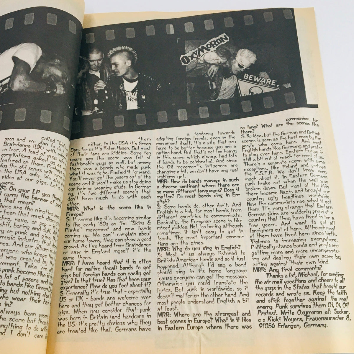Inside page of Maximum RocknRoll Magazine February 1996 #153 featuring band interviews and punk culture discussions.