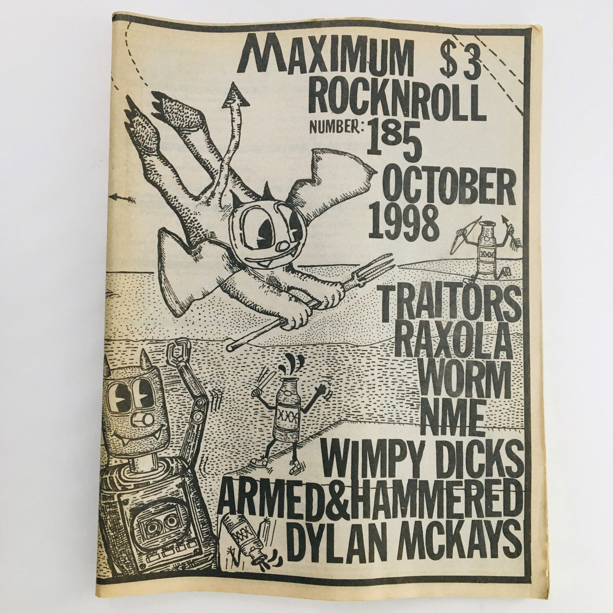 Cover of Maximum RocknRoll Magazine October 1998 issue number 185, featuring band names Traitors, Raxola, and whimsical illustrations.