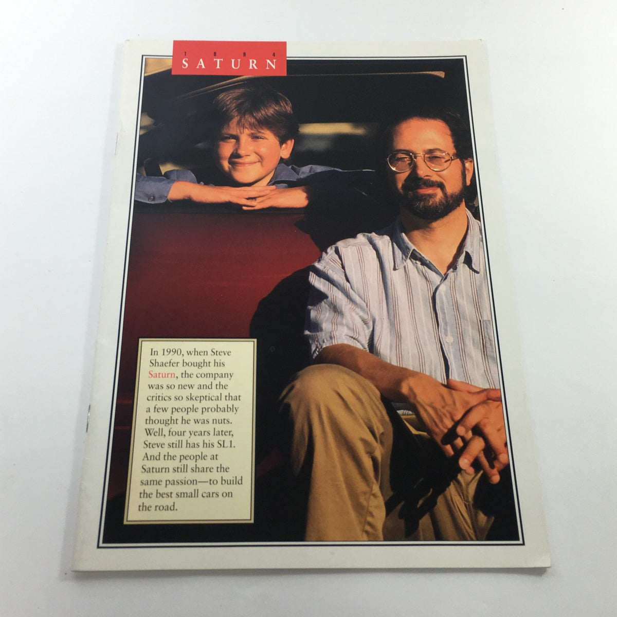 1994 Saturn SL-1 SW-1 SW-2 Dealership Car Auto Brochure Catalog featuring a boy and man seated in a car, discussing the Saturn brand in a nostalgic setting.