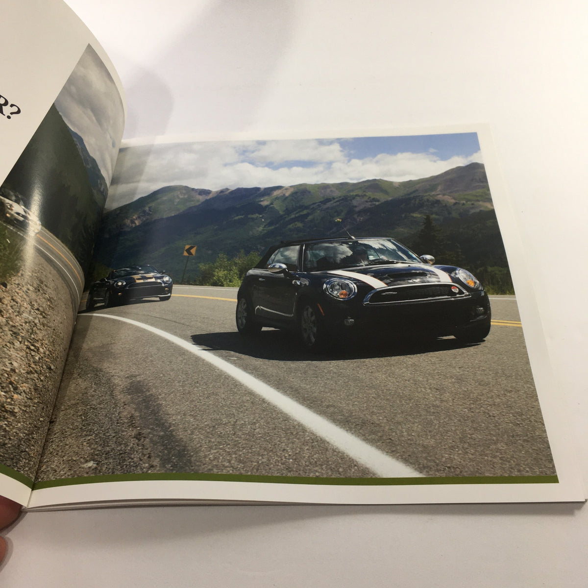 Interior page of the 2016 Mini Cooper Motor The Spectrum Colors Dealership Car Auto Brochure Catalog showing Mini cars driving on a scenic highway with mountains in the background.