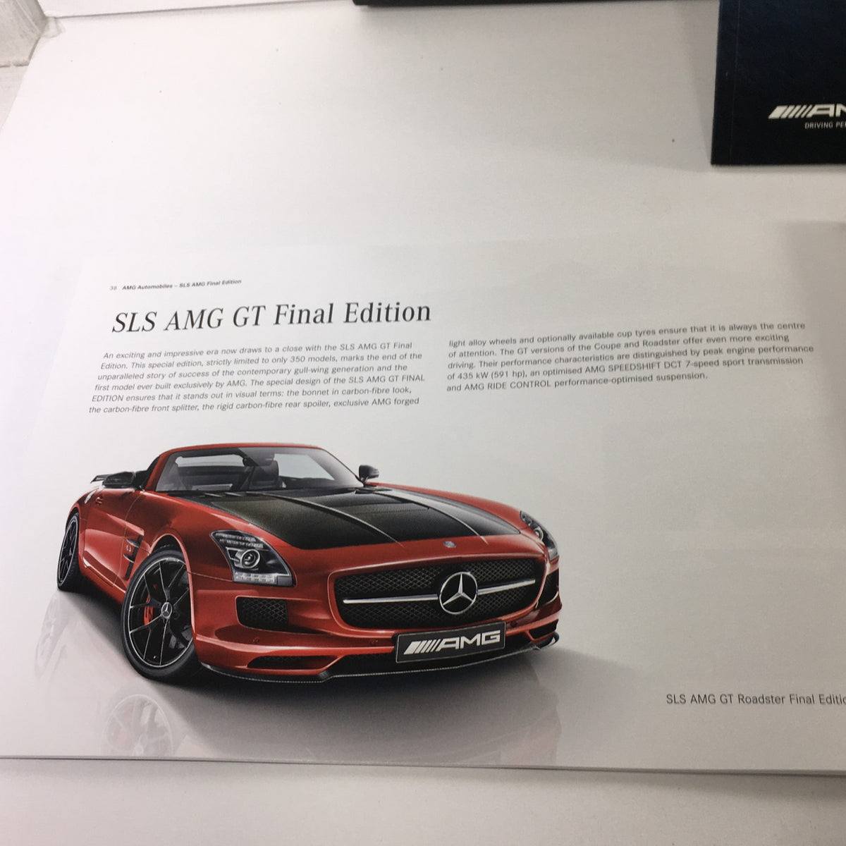 Page showcasing the SLS AMG GT Final Edition in the 2013 Mercedes-Benz AMG Portfolio Dealership Car Auto Brochure Catalog, featuring a red convertible model and detailed specifications.