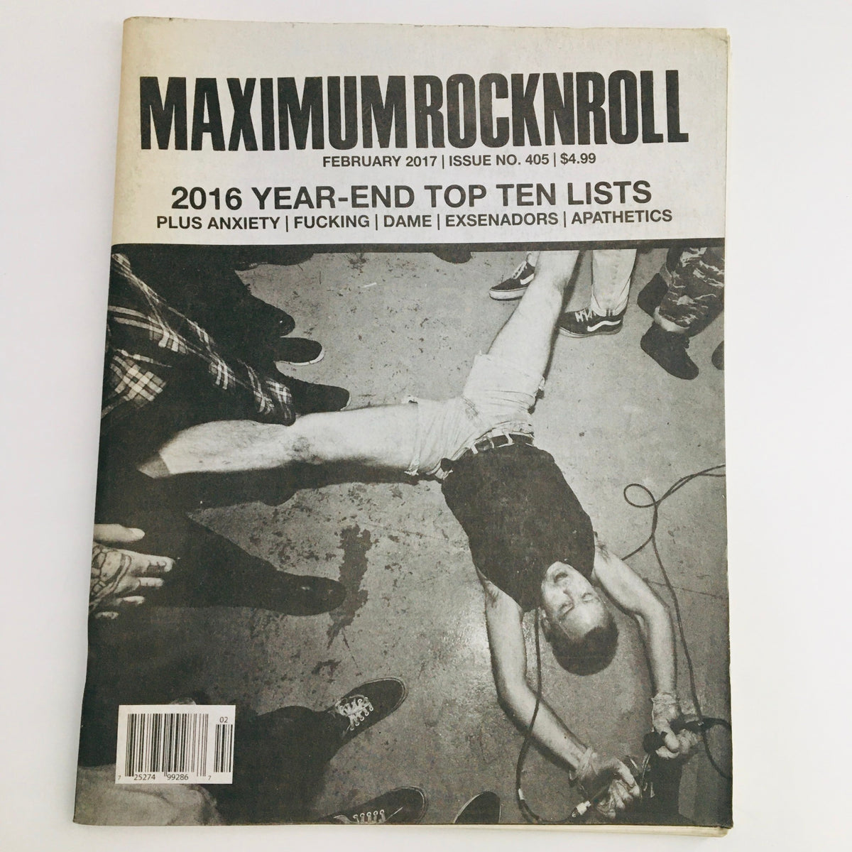 Cover of Maximum RocknRoll Magazine February 2017 #405 featuring punk music themes, with a dramatic image of a punk band performance.