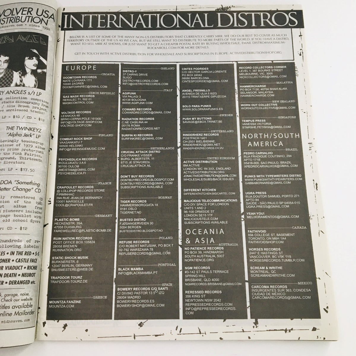 Page from Maximum RocknRoll Magazine July 2016 #398 listing international distributors, highlighting the global reach of punk music.