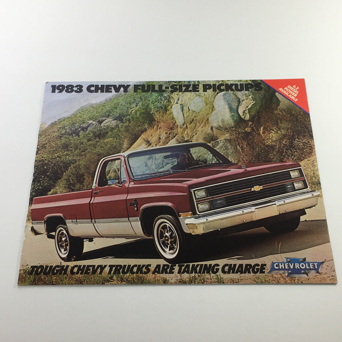 1983 Chevrolet Full-Size Pickup Dealership Car Auto Brochure Catalog featuring a red Chevy truck in a scenic outdoor setting.