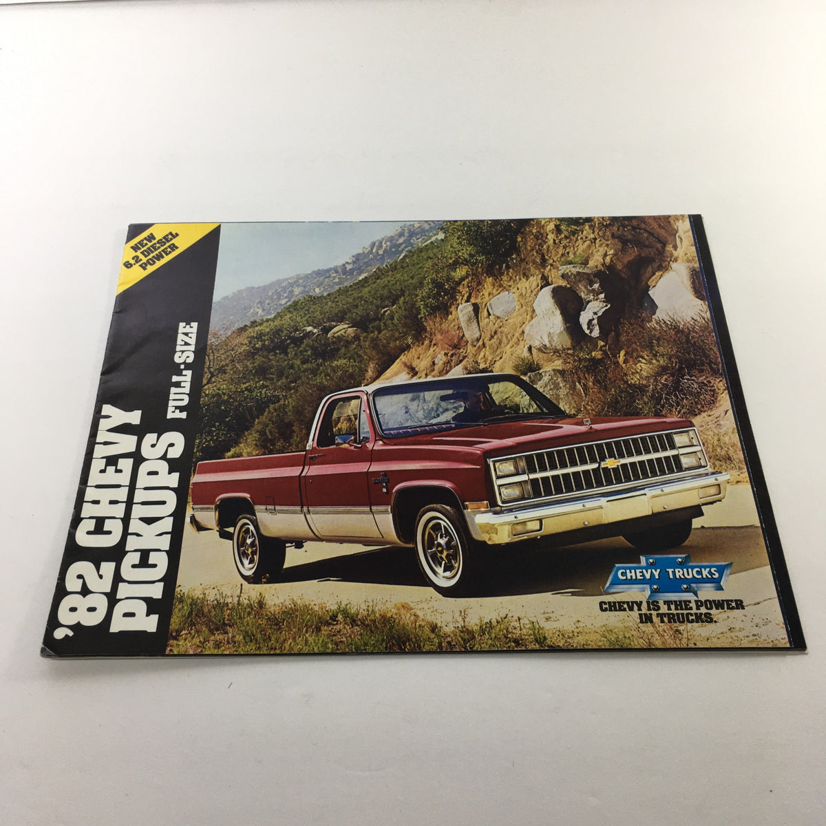 1982 Chevrolet Chevy Pickups Full-Size Dealership Car Auto Brochure Catalog cover featuring a red Chevy pickup truck in an outdoor setting.