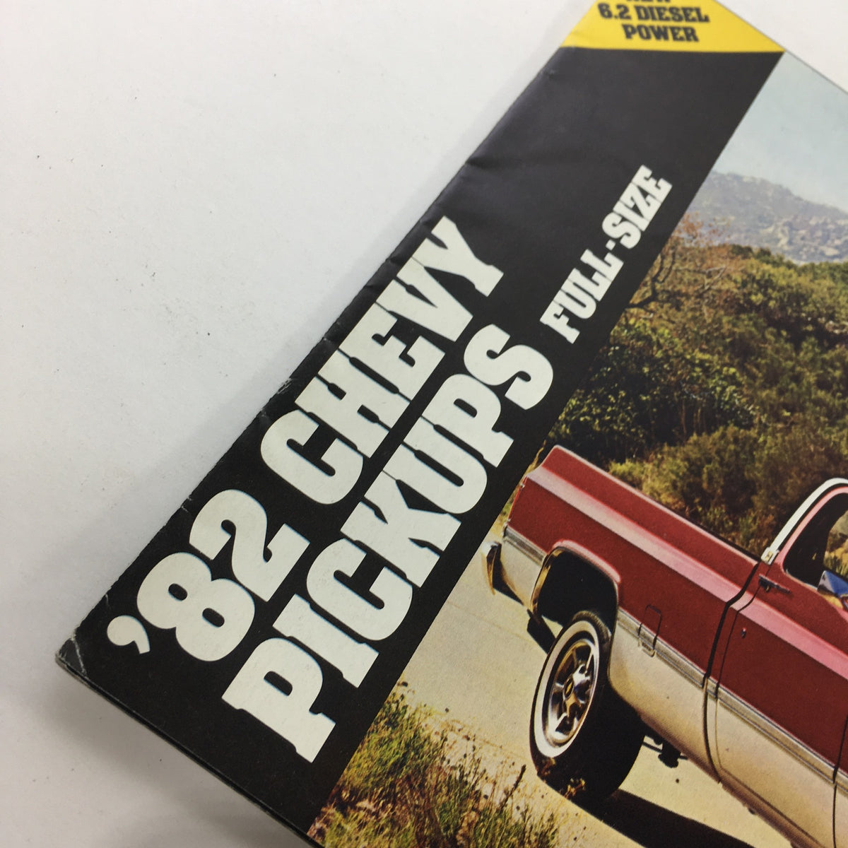 Close-up view of the 1982 Chevrolet Chevy Pickups Full-Size Dealership brochure title showing the text '82 CHEVY PICKUPS FULL-SIZE'.