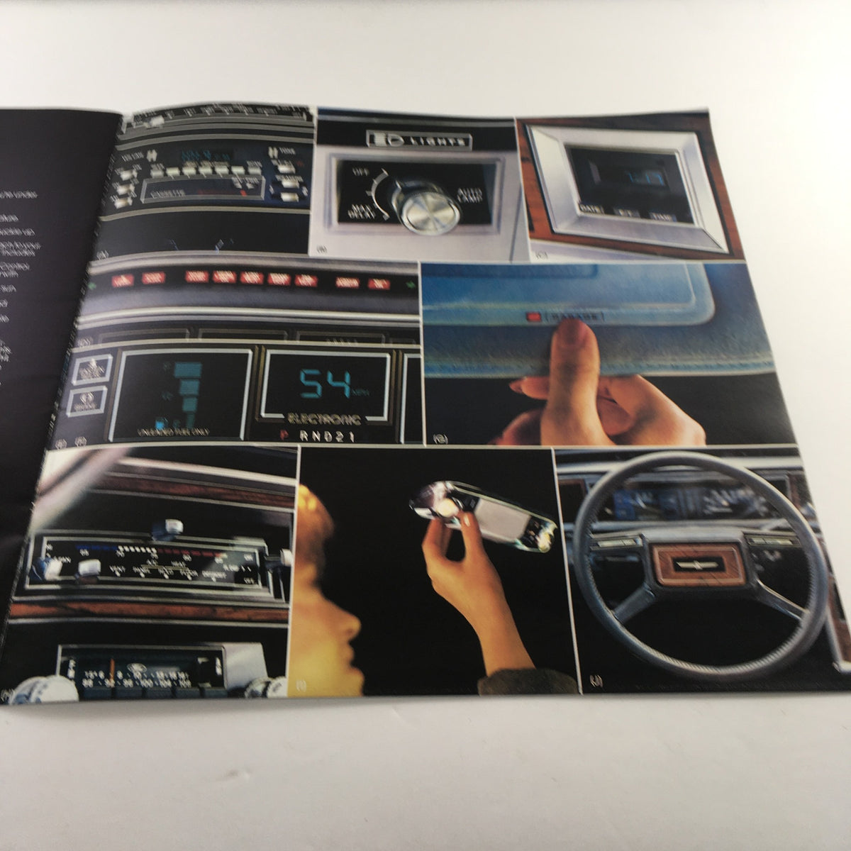 Interior detailed view from the 1980 Ford Thunderbird Dealership Car Auto Brochure Catalog, highlighting the dashboard, controls, and electronic features of the Thunderbird.