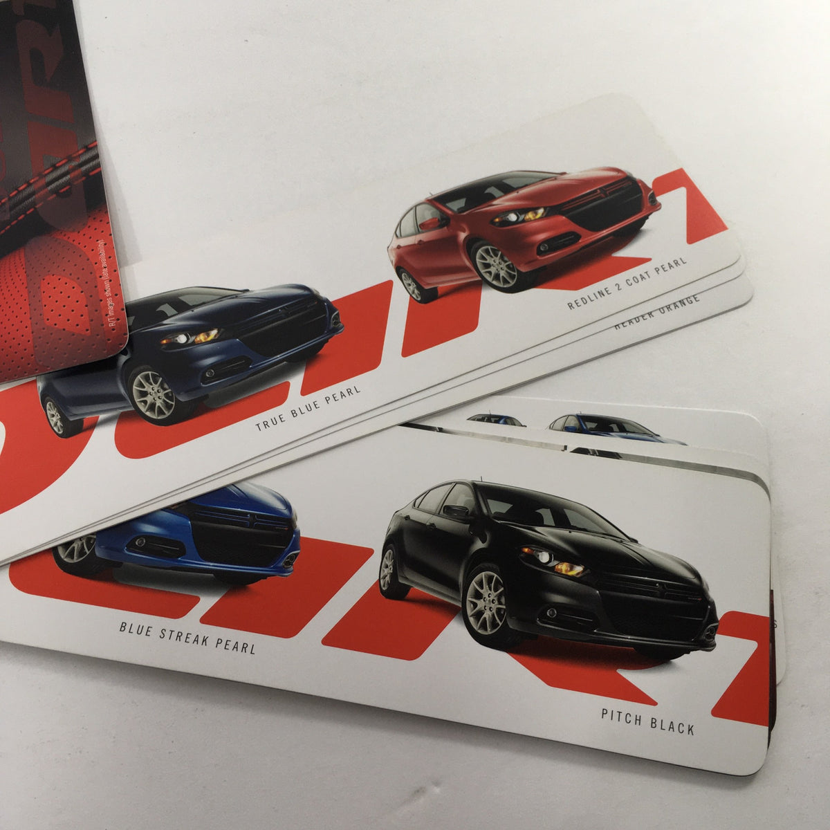 2012 Dodge Dart II Dealership Car Auto Brochure Catalog detailing color options with images of the Dodge Dart in Blue Streak Pearl and Pitch Black.