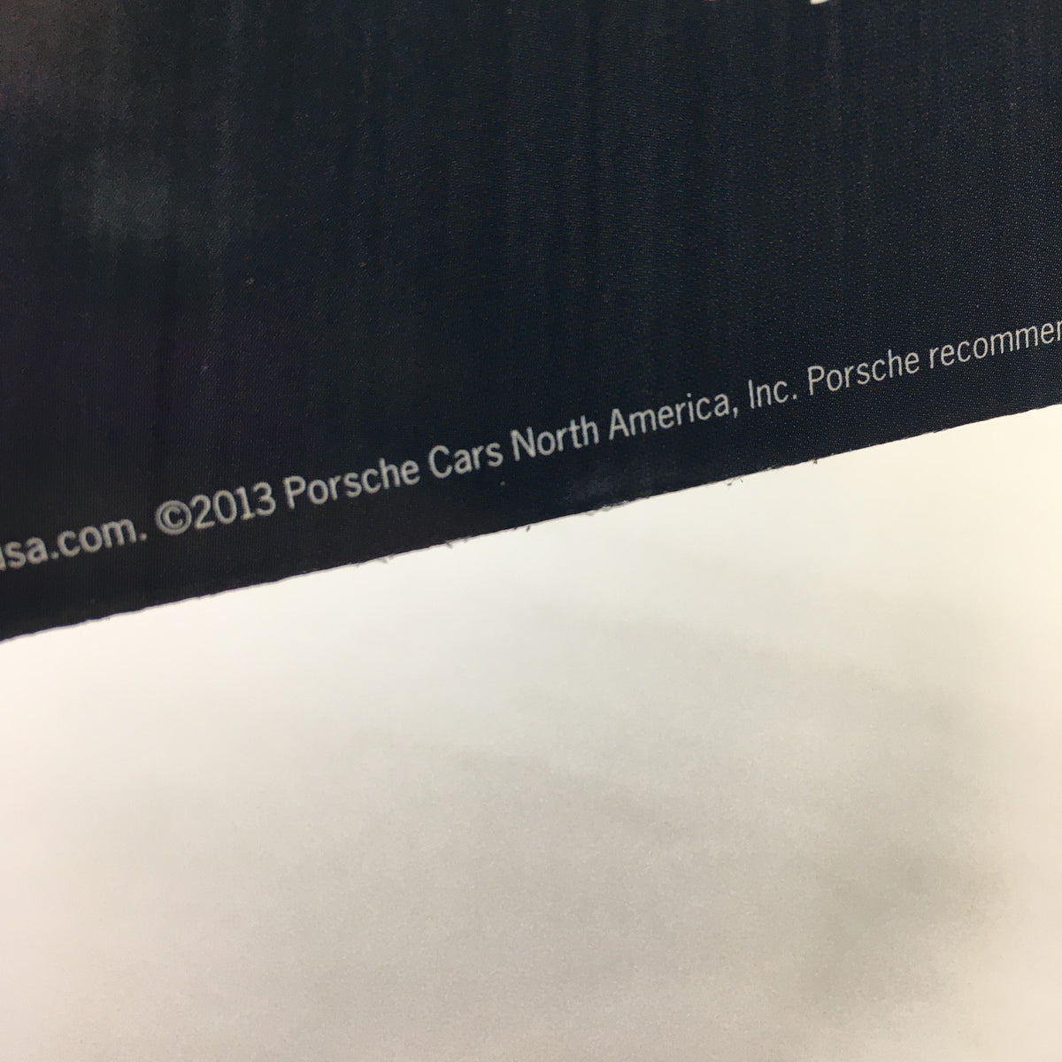 2013 Porsche Cayman Code Dealership Car Auto Brochure Catalog detailing of the copyright information on a page.