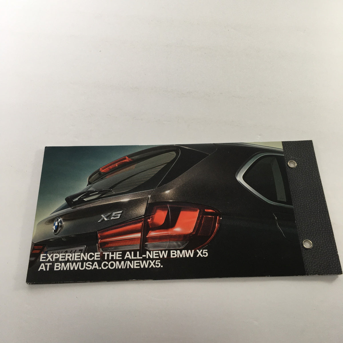 Back cover of the 2014 BMW X-5 Dealership Car Auto Brochure Catalog inviting readers to explore BMW's website for more information.