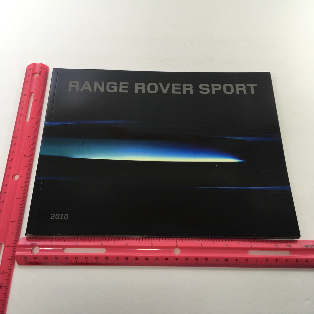 Front cover of the 2010 Land Rover Range Rover Sport Dealership Car Auto Brochure Catalog, highlighting the model name and design.