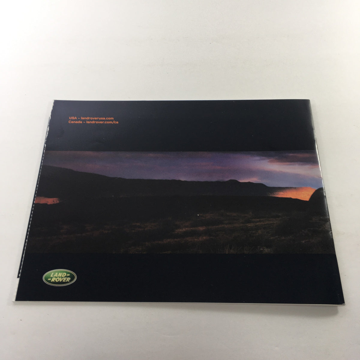 Cover image of the 2004 Land Rover Product Guide with a stunning landscape and the Land Rover logo, featured in this collectible dealership car auto brochure catalog.