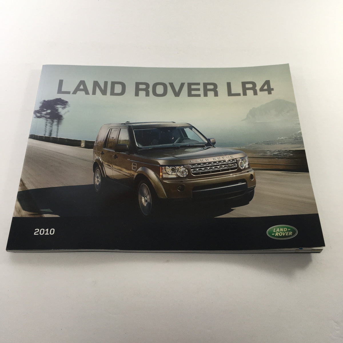 2010 Land Rover LR-4 Dealership Car Auto Brochure Catalog cover featuring a gold Land Rover LR4 on a scenic road.