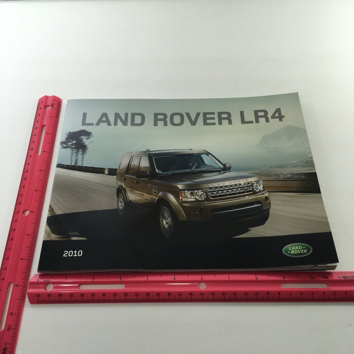 2010 Land Rover LR-4 Dealership Car Auto Brochure Catalog featuring a stylish image of the LR4 on the road. High-quality print brochure in good condition.