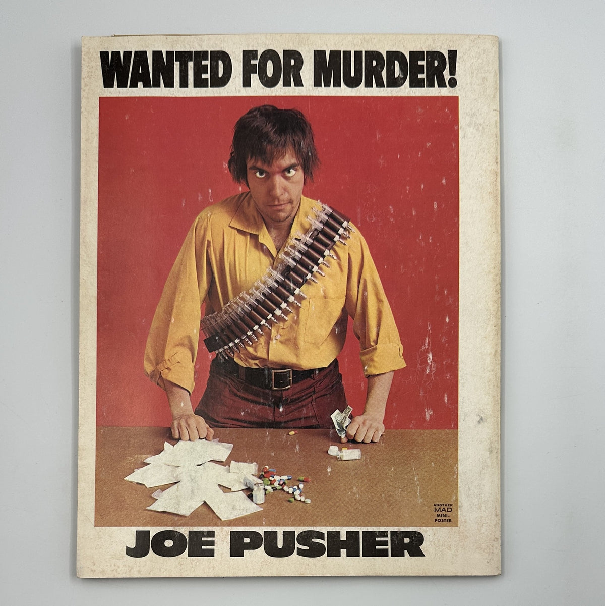 Cover of MAD Magazine Super Special 1976 No. 19 titled 'Wanted for Murder! Joe Pusher,' depicting a serious character with a bandolier, part of the comic's satire on crime and society, graded Fine (FN 6.0).