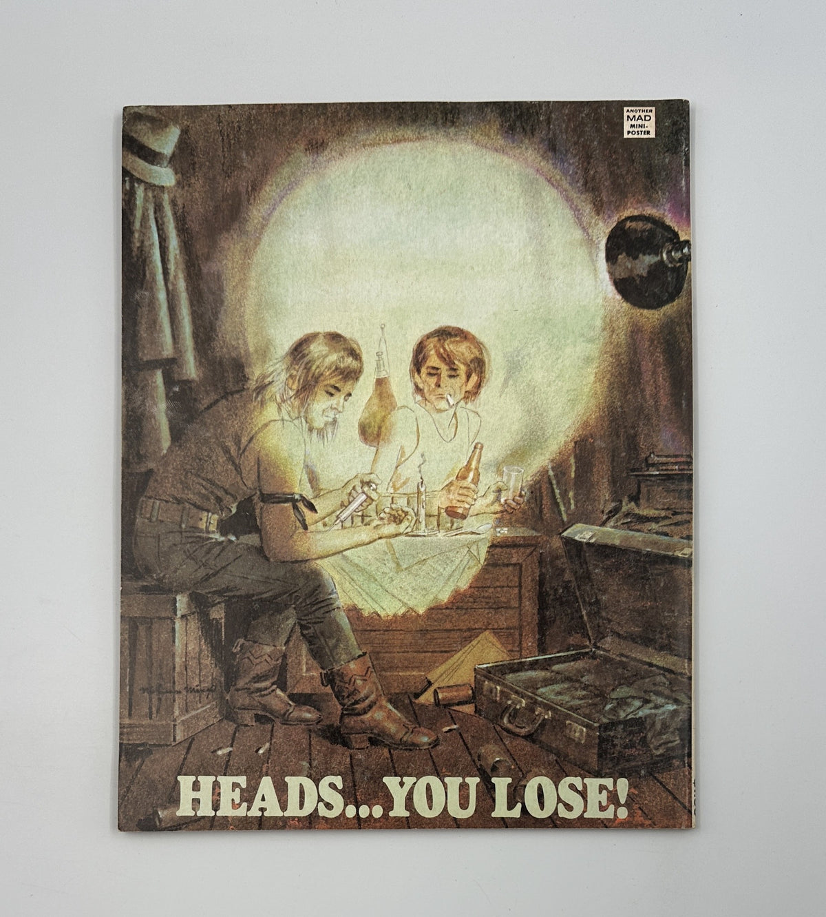 Cover of MAD Magazine No. 23 from 1967, featuring the title 'HEADS... YOU LOSE!' with an illustration of two boys playing and looking at bottles, indicative of the humor and satire typical of MAD Magazine.