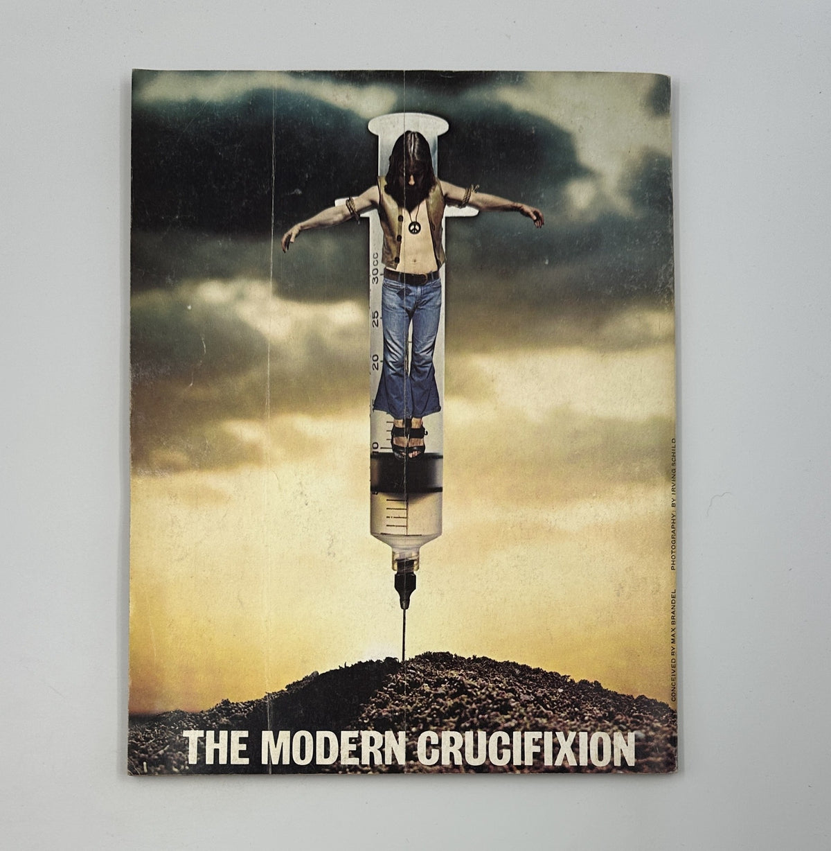 Back cover of MAD Magazine Super Special No. 16 depicting a striking graphic titled 'THE MODERN CRUCIFIXION.' This image exemplifies the edgy satire characteristic of the publication.