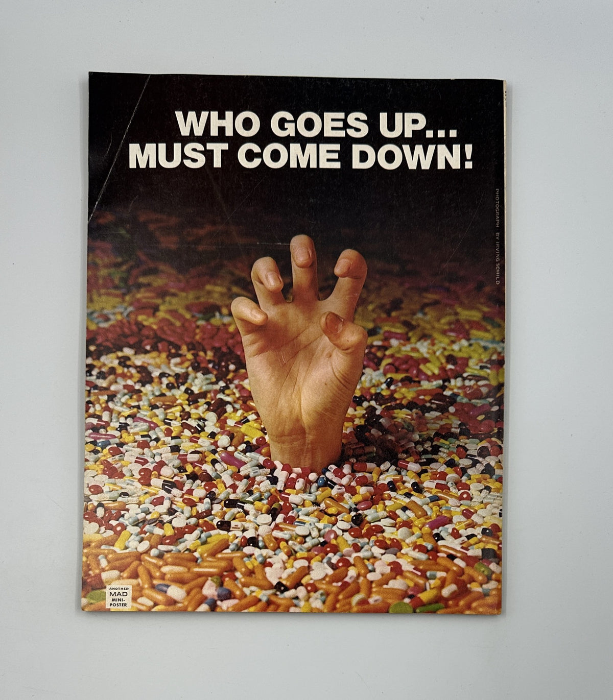 Back cover of MAD Magazine Super Special No. 28 Fall 1979 showing a creative image with a hand emerging from candy, featuring the caption 'Who goes up... must come down!'