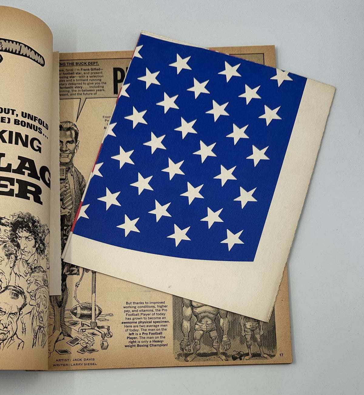 The MAD Flag Poster included in MAD Magazine Super Special No. 5, showcasing a bold design with a blue background and white stars.