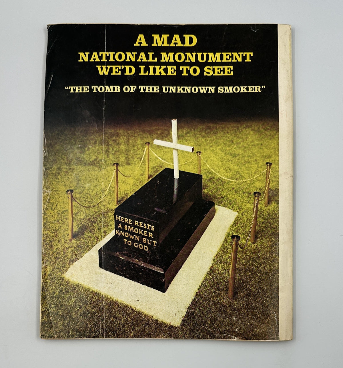 Back cover of MAD Magazine Super Special No. 9 depicting a satirical monument titled 'The Tomb of the Unknown Smoker,' showcasing MAD's distinct blend of humor and commentary.