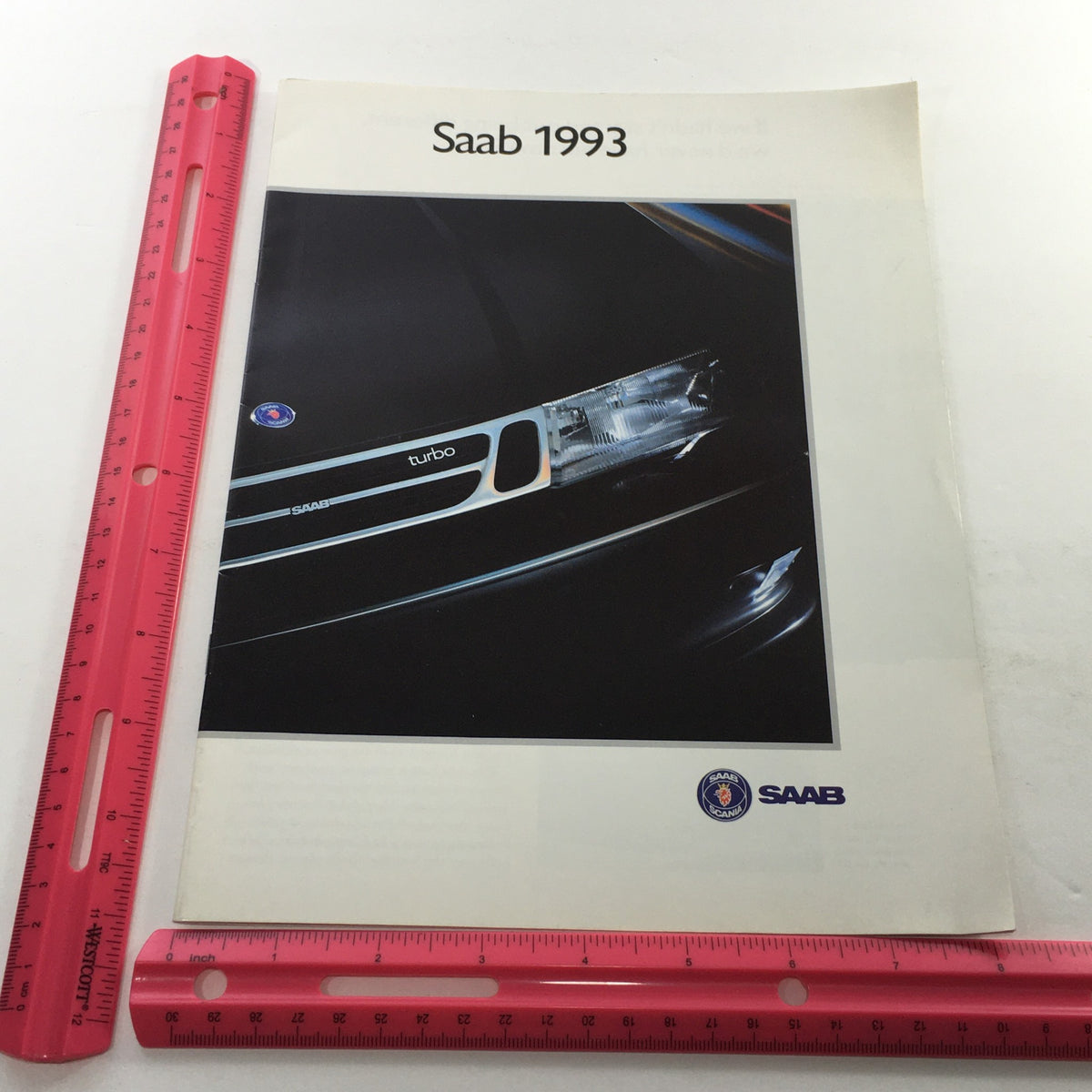 Front view of the 1993 Saab 900 Turbo Series Dealership Car Auto Brochure Catalog featuring a close-up of the Saab logo and 'turbo' branding, emphasizing the distinct styling of the vehicle.