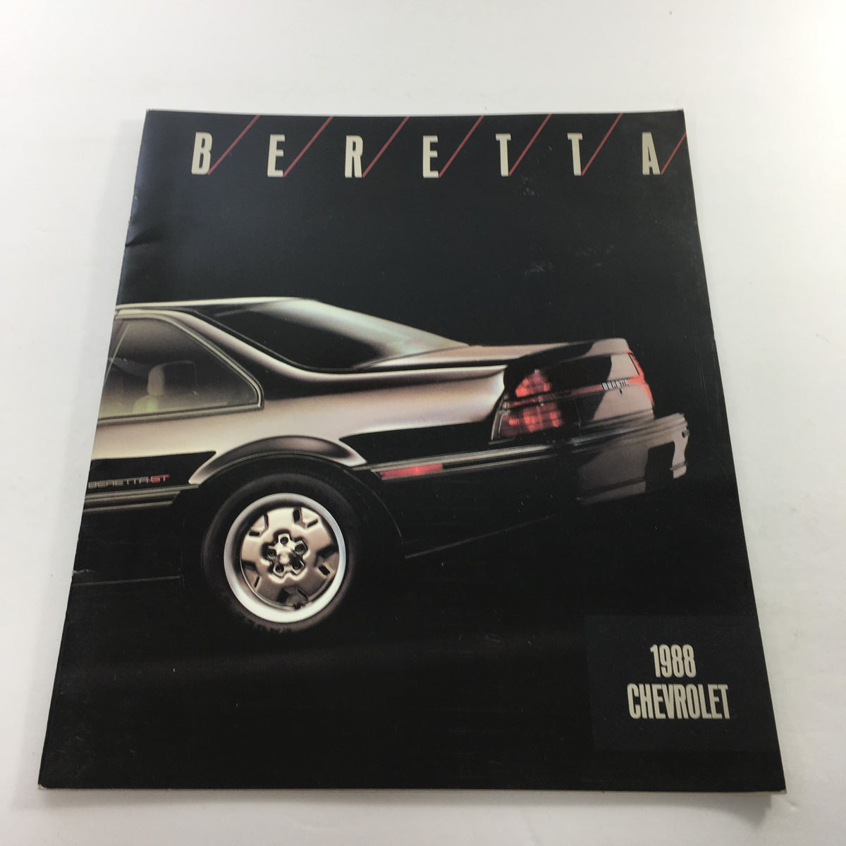 1988 Chevrolet Beretta Dealership Car Auto Brochure Catalog cover featuring a side view of the Chevrolet Beretta GT, showcasing its sleek design and distinctive rear profile.