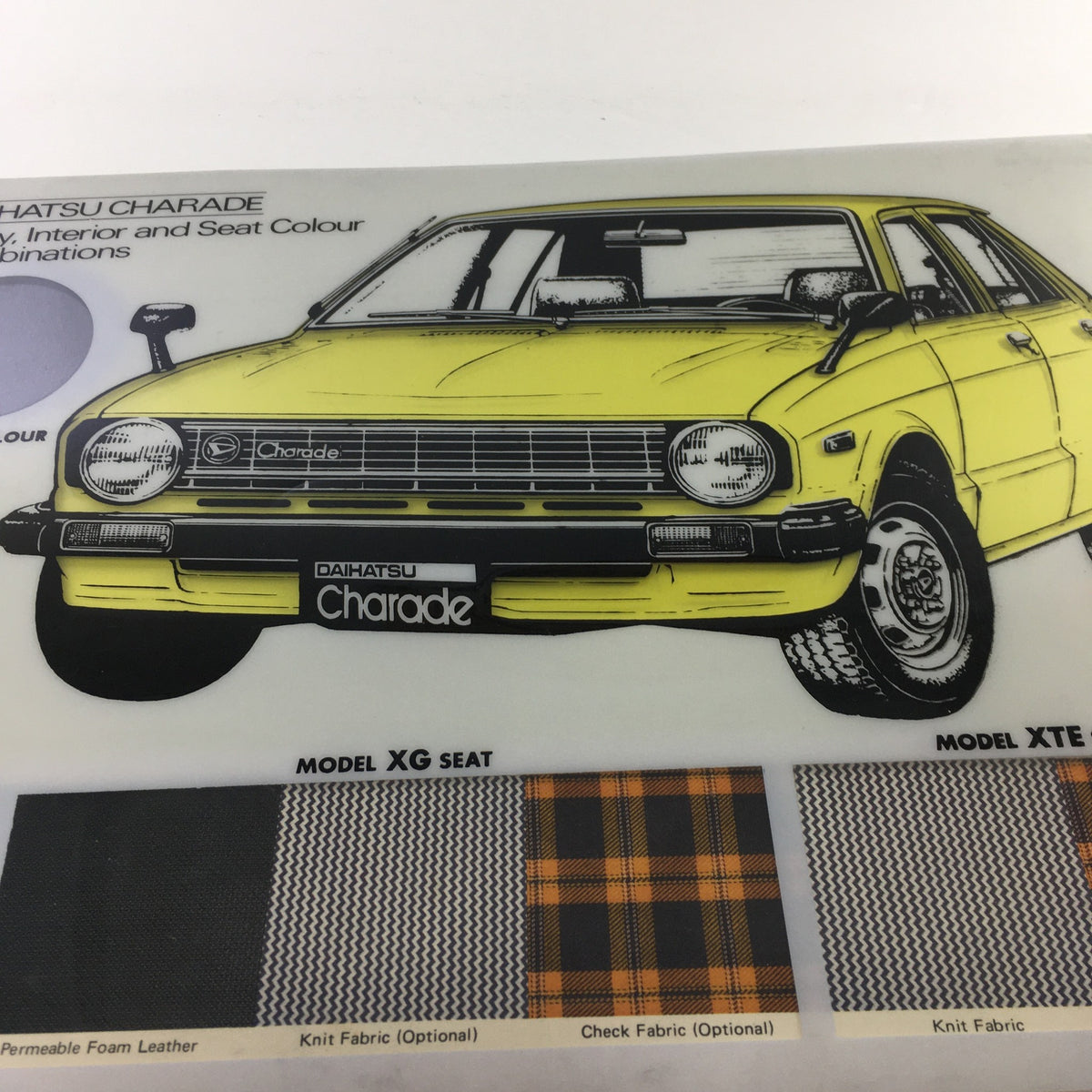 1980s Daihatsu Charade Dealership Brochure featuring body and interior color options with a close-up of a yellow car.