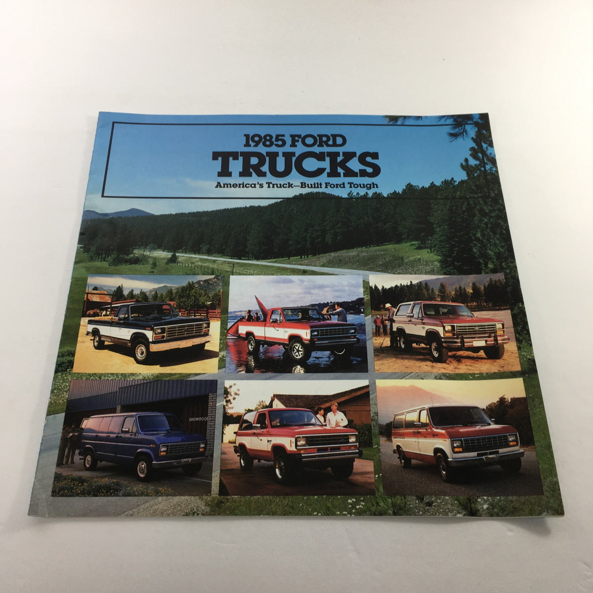 1985 Ford Trucks Ranger brochure cover featuring a collage of Ford trucks in various settings. The caption reads 'America's Truck—Built Ford Tough'.