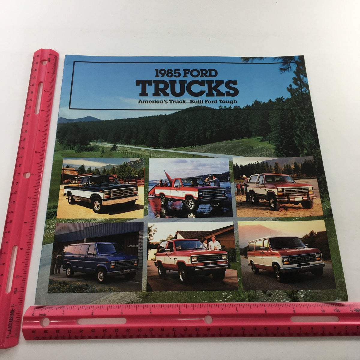Cover of the 1985 Ford Trucks Ranger 4x4 4x2 Dealership Car Auto Brochure Catalog featuring images of various Ford trucks in scenic outdoor settings, showcasing their ruggedness and versatility.