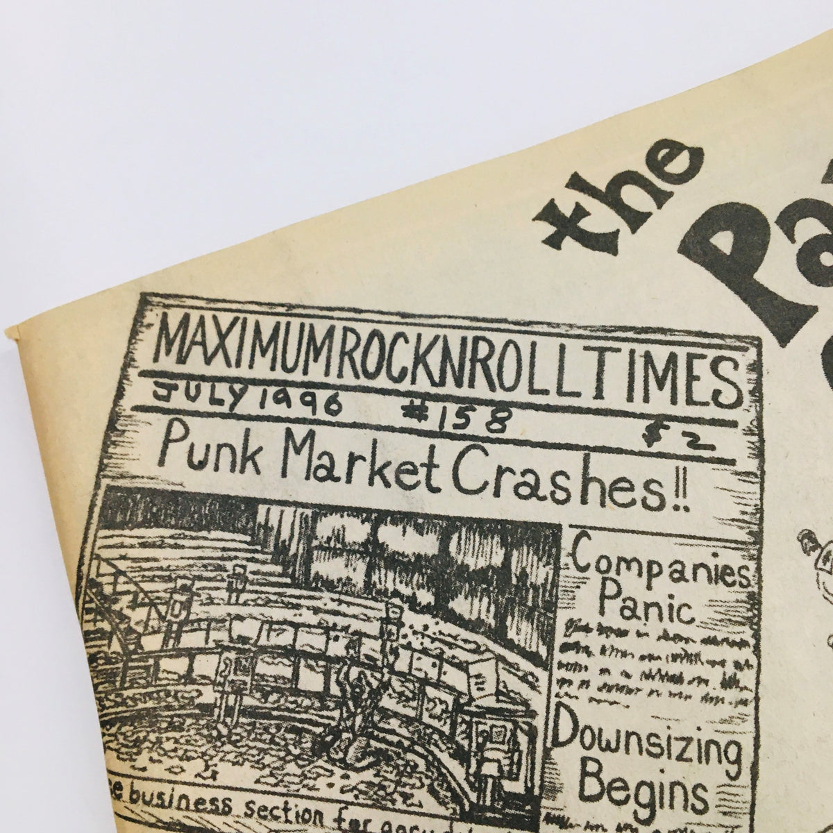Close-up of the cover of Maximum RocknRoll Magazine July 1996 Issue #158 highlighting 'Punk Market Crashes!!' as the main headline.