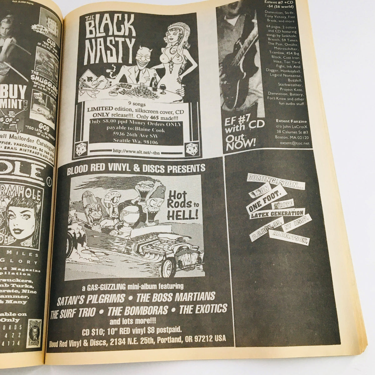 Advertisement page from Maximum RocknRoll Magazine July 1996 #158 displaying promotions for indie music releases and vinyl records, representing the DIY spirit of the punk rock scene.