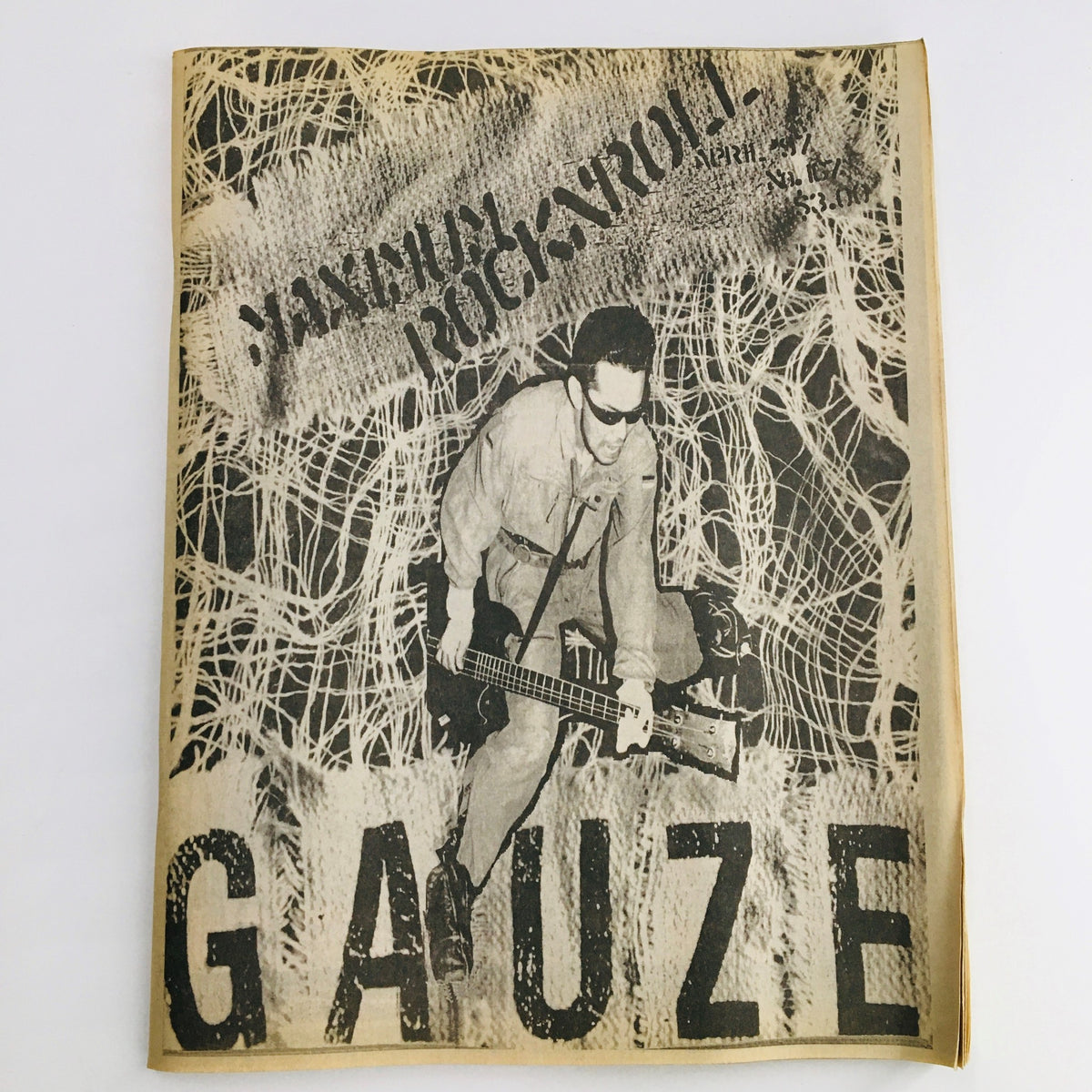 Cover of Maximum RocknRoll Magazine April 1997 featuring Japanese punk band Gauze, showcasing a punk aesthetic with a prominent graphic design.