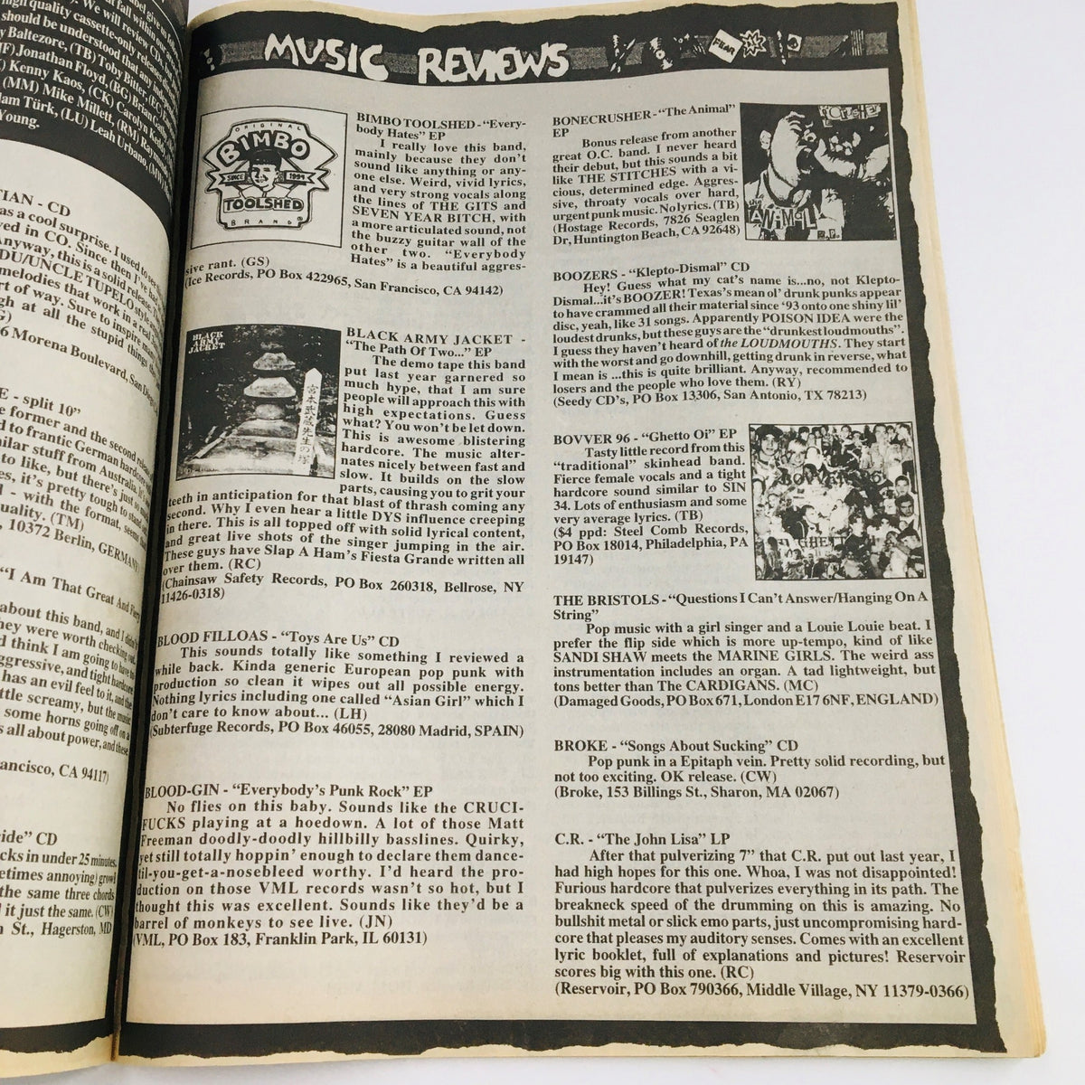Music review section of Maximum RocknRoll Magazine April 1997, featuring reviews of various punk music releases, emphasizing the magazine's role in punk music criticism.