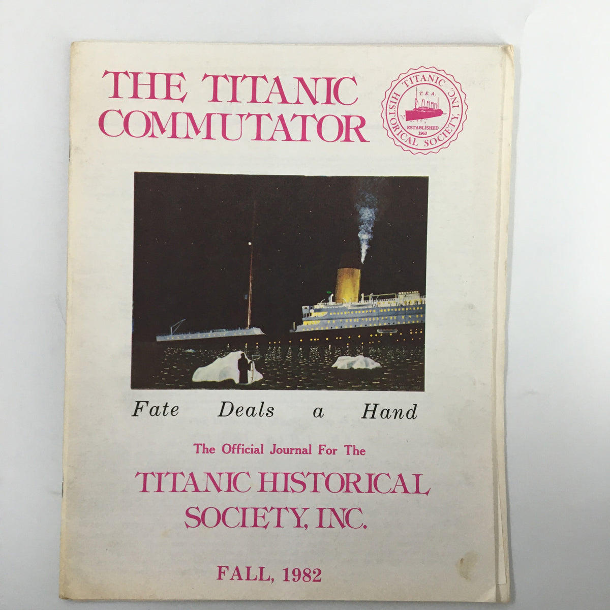 Cover of the magazine 'The Titanic Commutator' Fall 1982 edition titled 'Fate Deals a Hand' featuring the Titanic and icebergs.