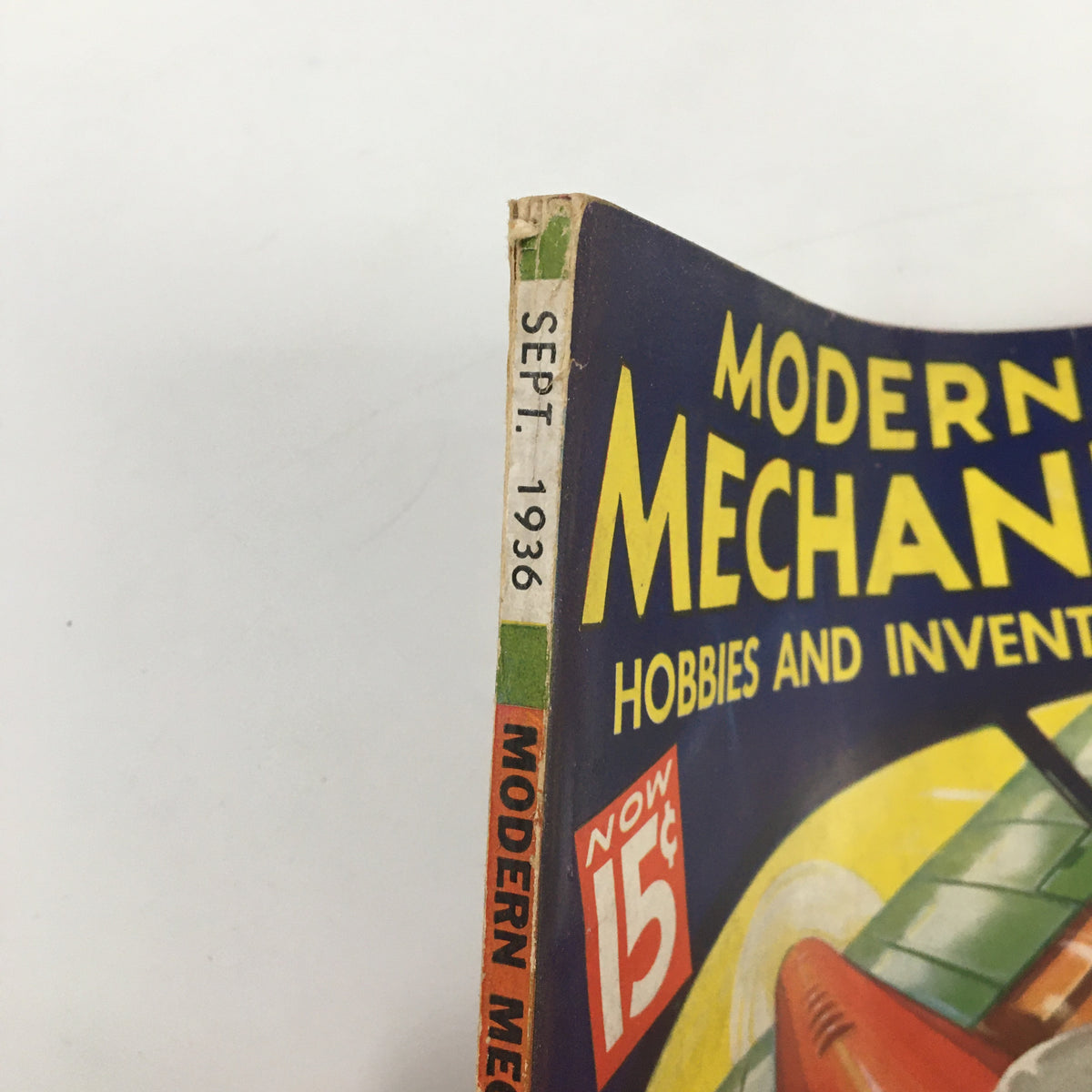 Spine detail of VTG Modern Mechanix Magazine September 1936 showing the title and publication month, highlighting its vintage design and collectible nature.