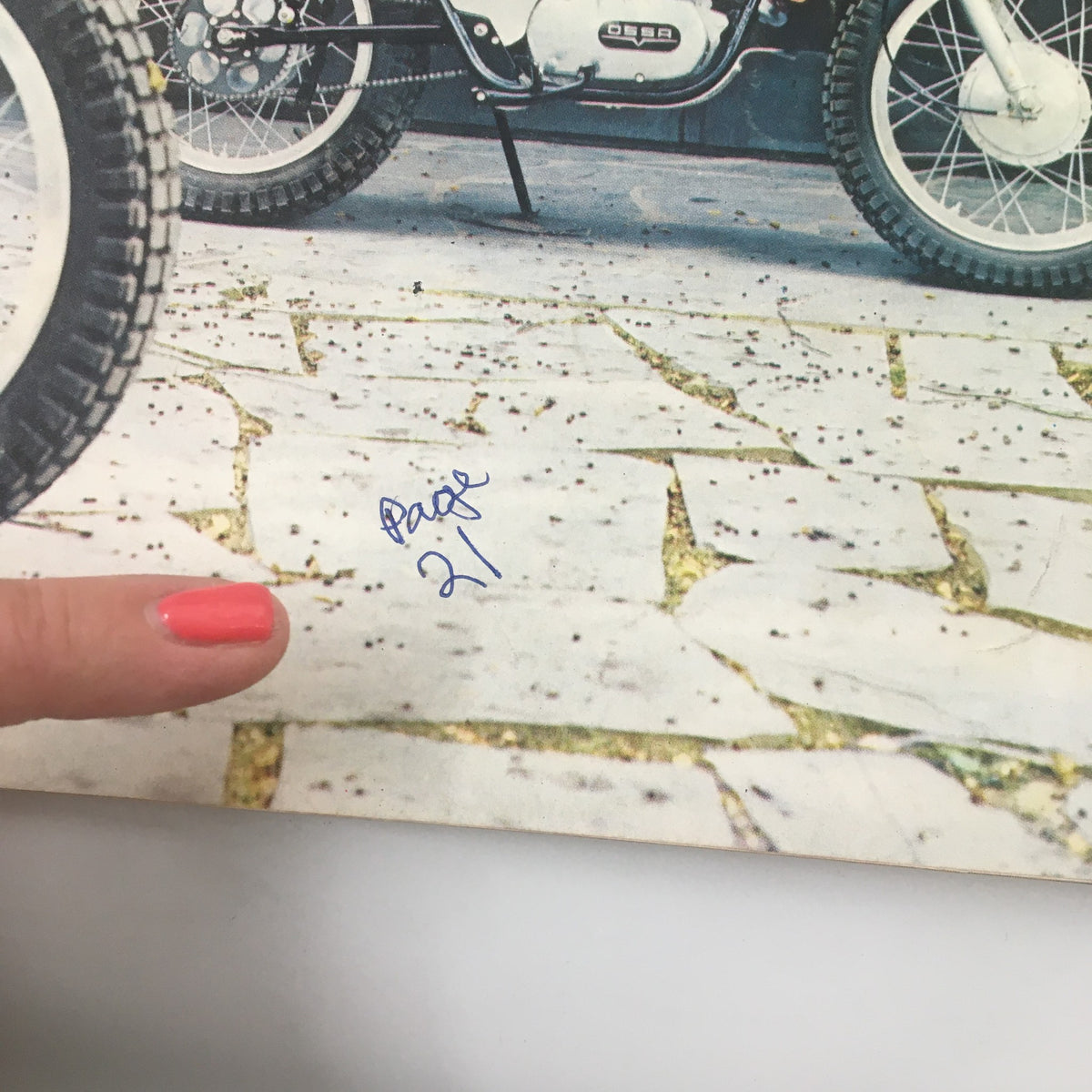 Close-up of a motorcycle on the cover of VTG Cycle Magazine December 1967, highlighting the detail of BSA's Big New 1968 Thunderbolt and a handwritten page number.