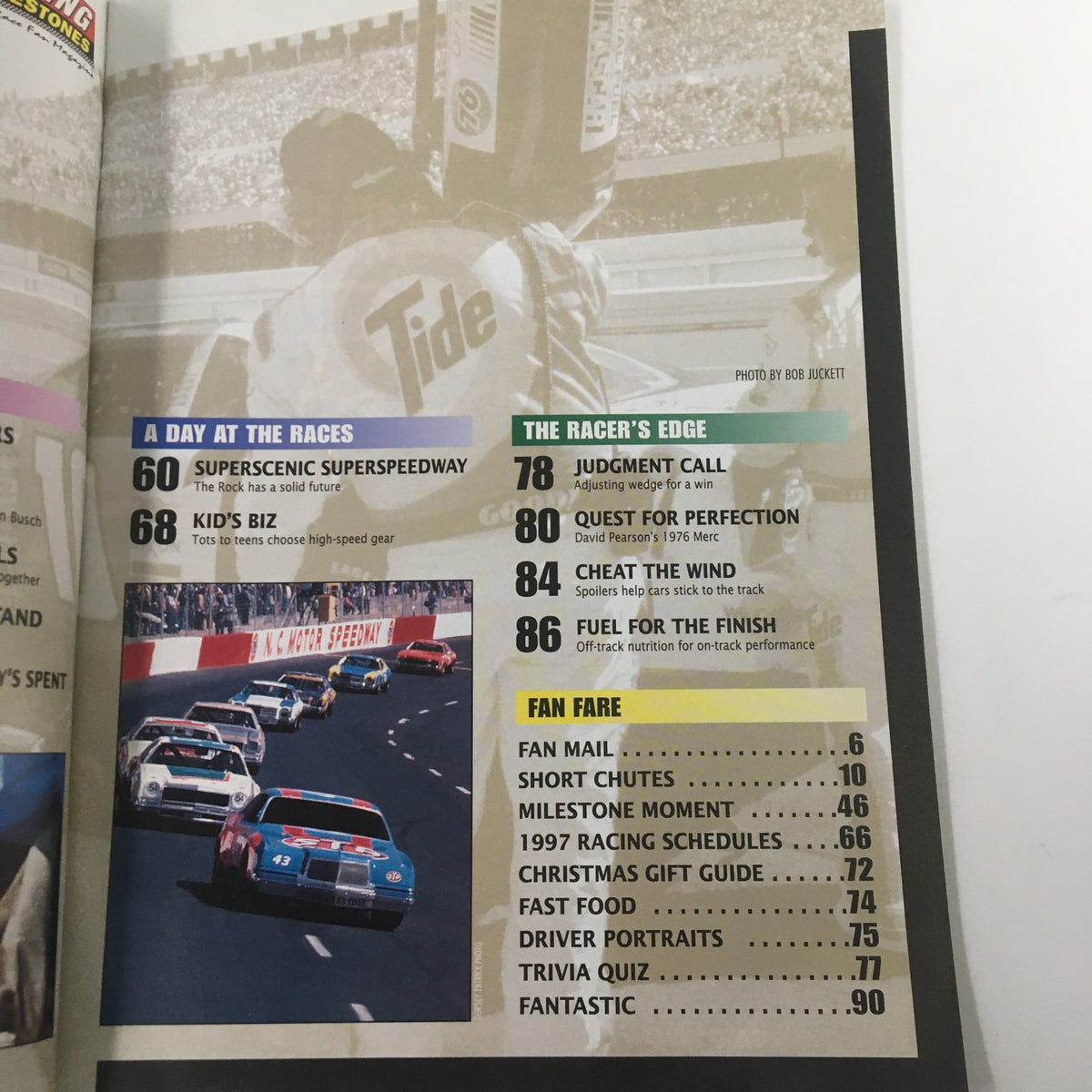 Page from Racing Milestones Magazine Fall 1997, displaying a lineup of race cars and highlights on events like 'Superscenic Superspeedway'.