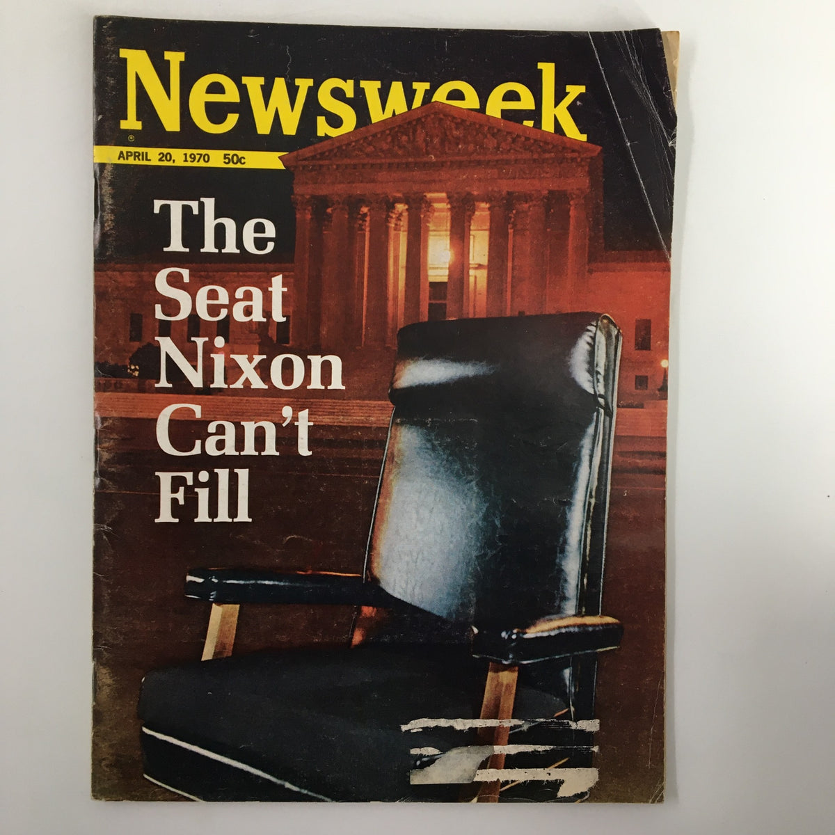 Cover of the vintage Newsweek Magazine from April 20, 1970, titled 'The Seat Nixon Can't Fill', featuring an empty black office chair and a backdrop of a historic building.