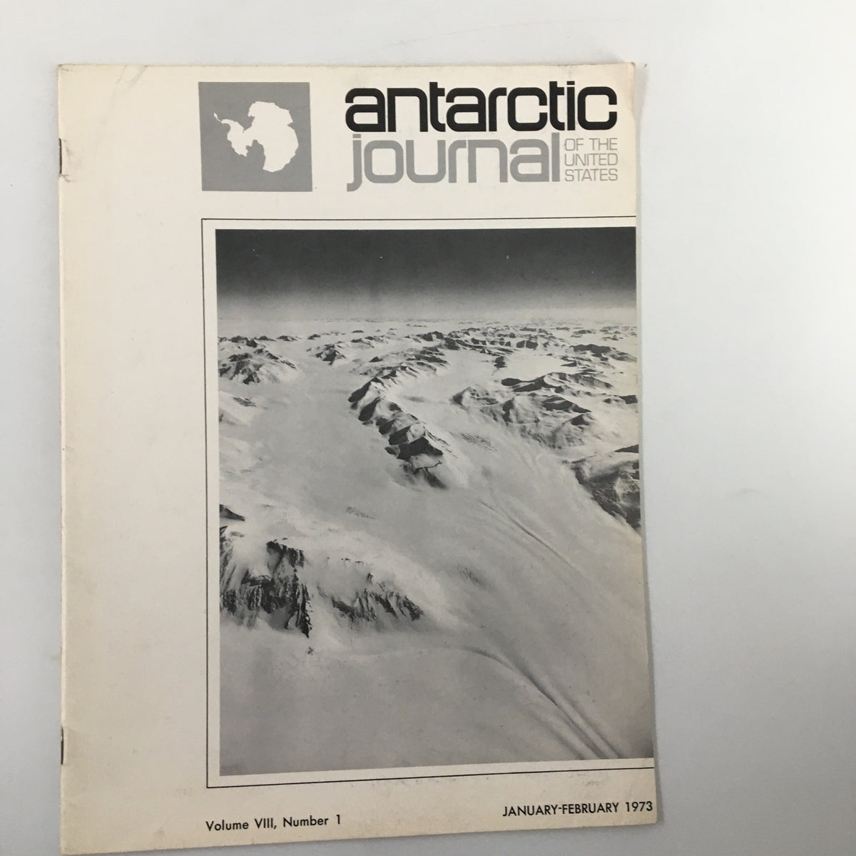 Cover of the VTG Antarctic Journal of The United States, January 1973, featuring a striking aerial view of snow-covered mountains and glaciers, indicative of the magazine's focus on Antarctic exploration and scientific research.