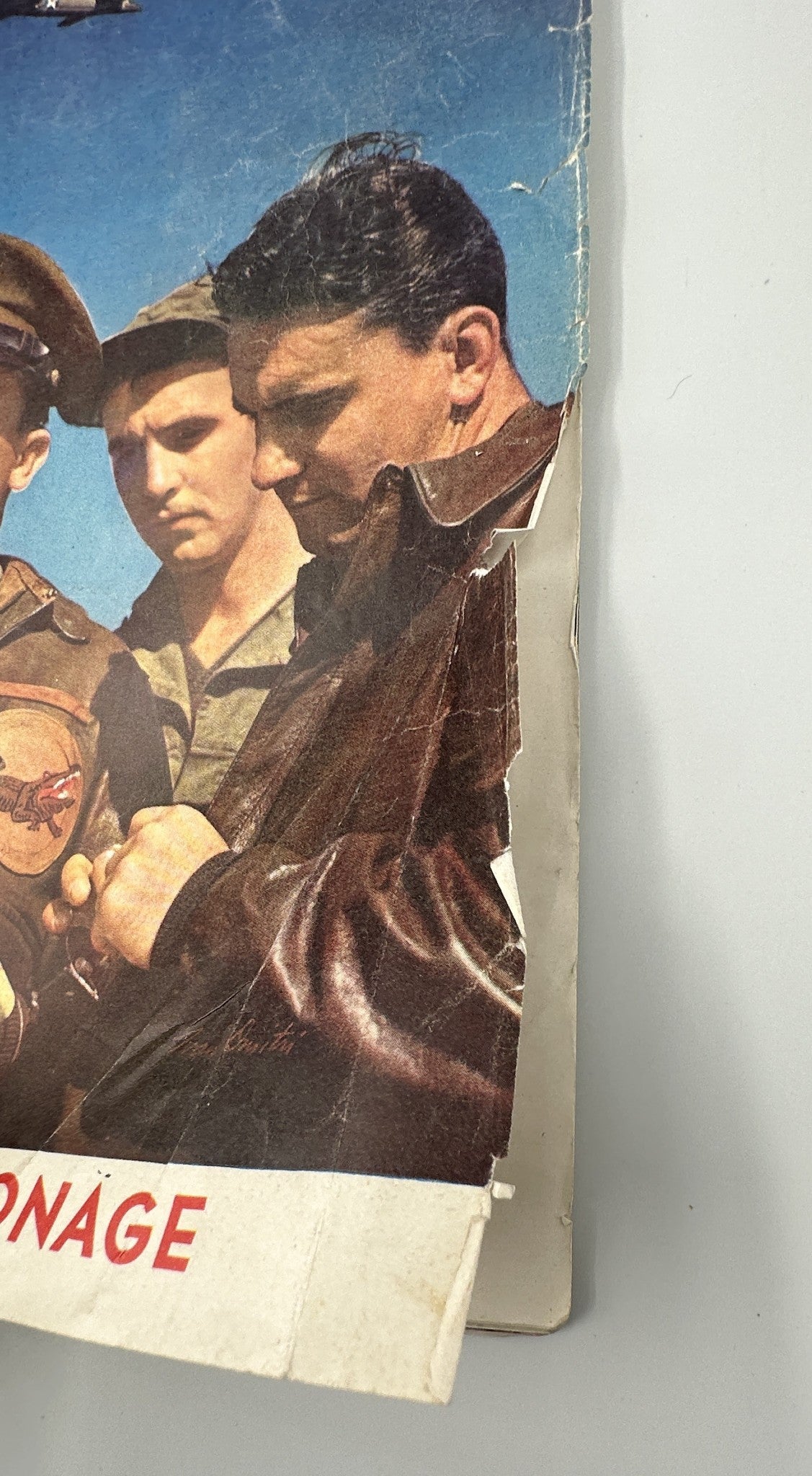 Side view of Saturday Evening Post Magazine from May 16, 1942, showing wear and tear, including a torn edge, emphasizing the magazine's vintage condition.