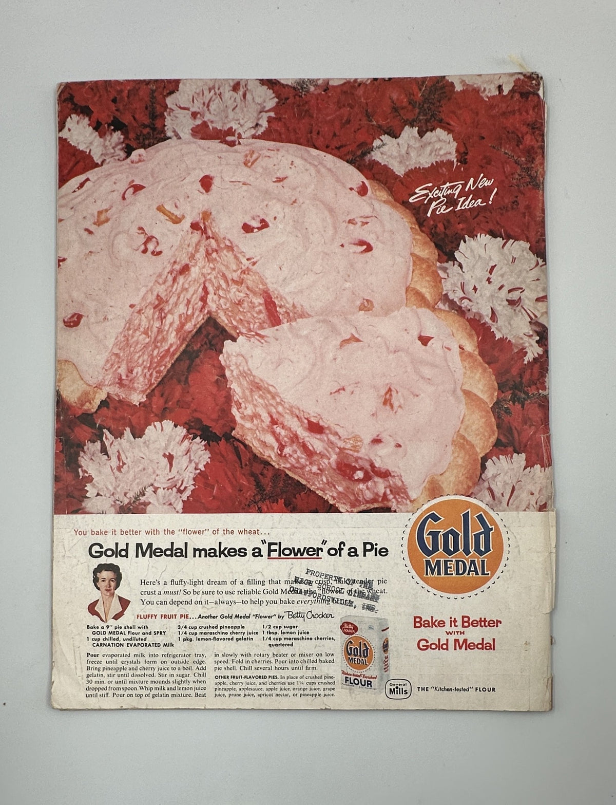 Back cover of Saturday Evening Post Magazine from September 7, 1957, featuring an advertisement for Gold Medal flour, prominently showcasing a pie with the tagline 'Gold Medal makes a Flower of a Pie'.